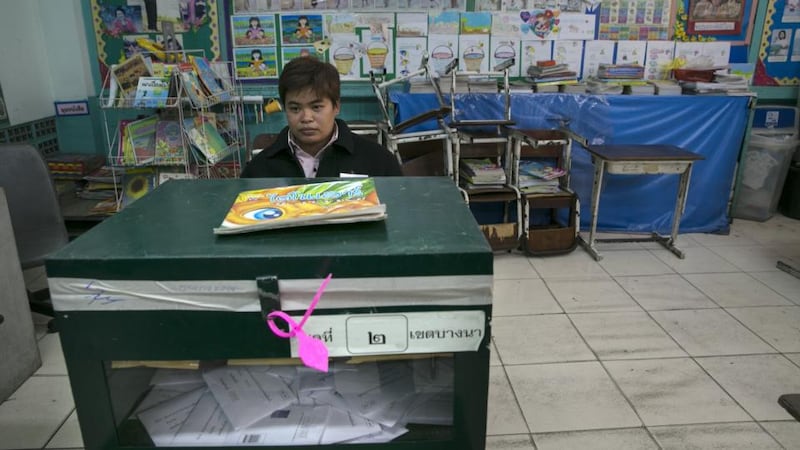 A Thai election worker waits for instructions at a recently closed polling station as advanced voting for the February 2nd general elections was unable to continue due to anti-government protesters blocking the polls today. Photograph:  Paula Bronstein/Getty Images