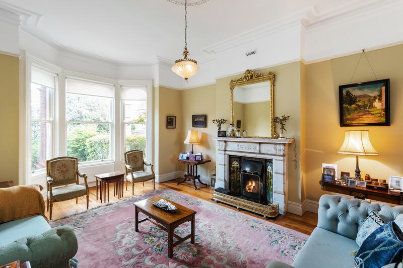 The drawing room has a fine bay window overlooking the front garden