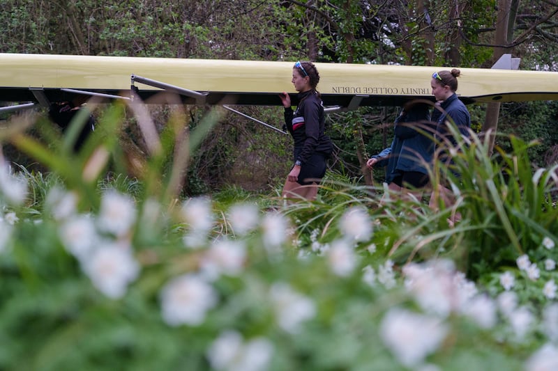 One of the novice Trinity teams moving their boat from a weir on the river Liffey to make their way down to the start line some 4km away. Photograph: Barry Cronin