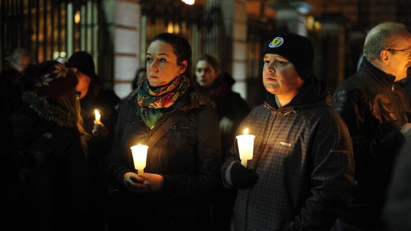 ‘B&B or hotel accommodation may provide basic shelter but a situation where a whole family has to share one room, with no access to cooking facilities, where the children have no space to play and cannot invite their friends in, and where parents have to make long and expensive bus journeys to bring their children to school is just not acceptable.’ Above,  a candlelight vigil outside the Dáil in response to the death on Molesworth Street of Jonathan  Corrie who was homeless. Photograph: Aidan Crawley