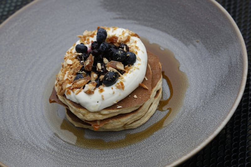 Blueberry Pancakes with vanilla mascarpone, almond praline and organic maple syrup.  Photograph: Nick Bradshaw