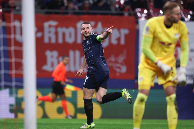 John McGinn celebrates scoring Aston Villa's opening goal. Photograph: Ronny Hartmann/AFP via Getty Images