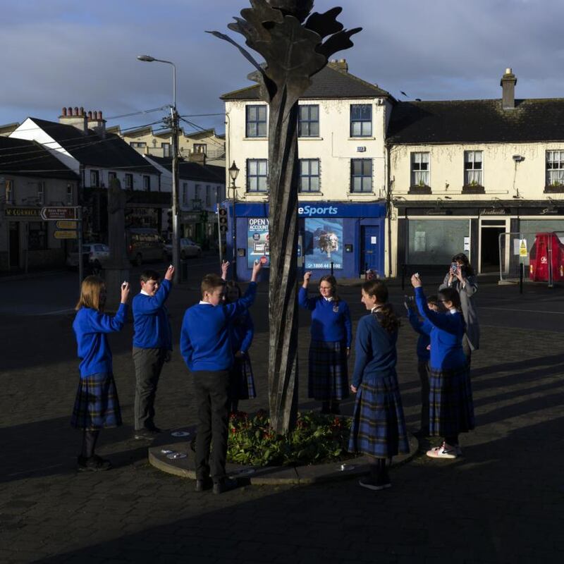 Children from a local school perform a ritual to St Brigid’s eternal flame, located in the market square in Kildare town. Photograph: Paulo Nunes dos Santos/New York Times