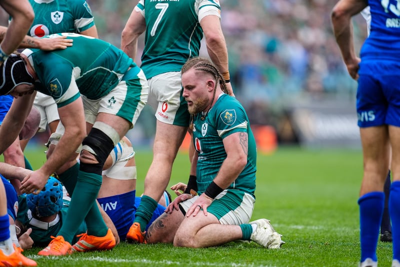 Ireland's Finlay Bealham was held up over the line by Italy during the game in Rome. Photograph: Matteo Ciambelli/Inpho