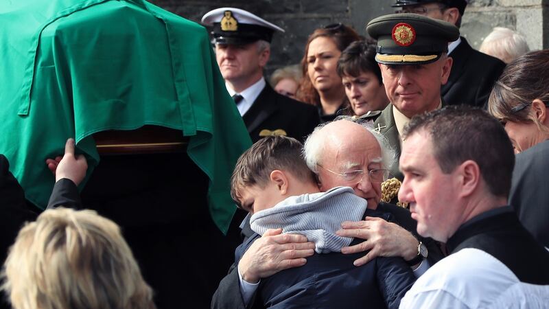 President Michael D Higgins embraces Fionn, the son of  Capt Mark Duffy, at St Oliver Plunkett Church, Blackrock, Co Louth, this morning, at his funeral. Photograph: Colin Keegan/Collins Dublin