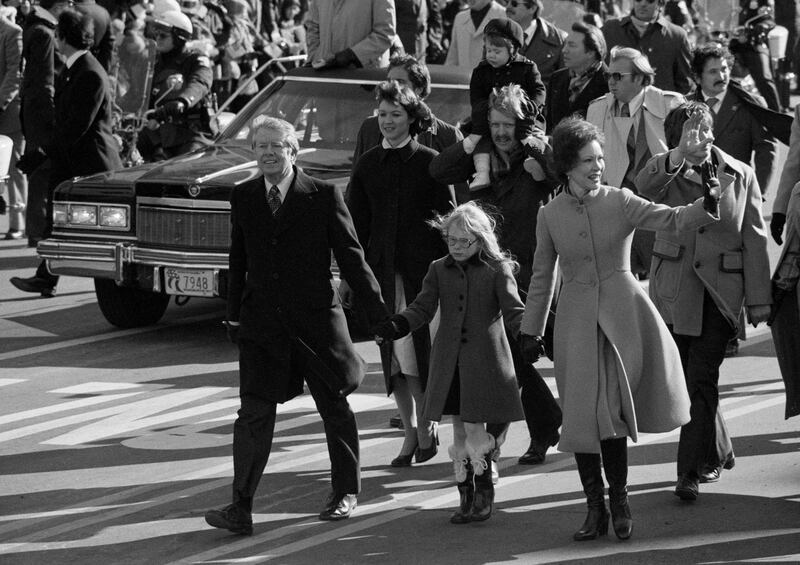 President Jimmy Carter and first lady Rosalynn Carter walk with their daughter Amy down Pennsylvania Avenue during the 1977 Inaugural Parade in Washington on January 20th, 1977. Photograph: Paul Hosefros/The New York Times
                      