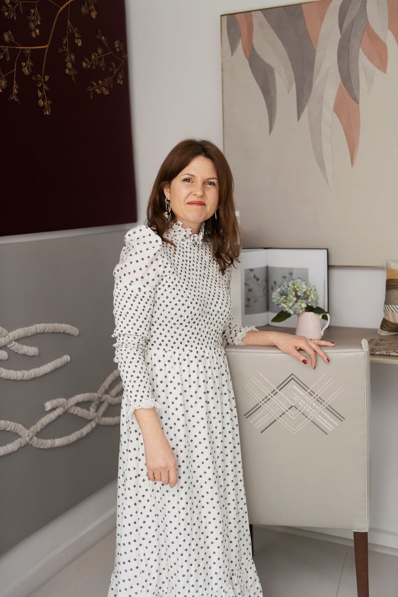 London-based Aiveen Daly in front of some of her custom embroidered panels