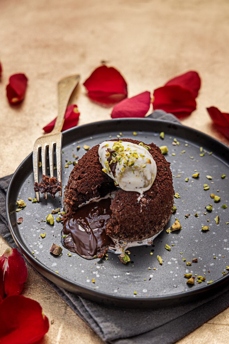 Cheats chocolate fondant with pistachio ice cream. Photograph: Harry Weir