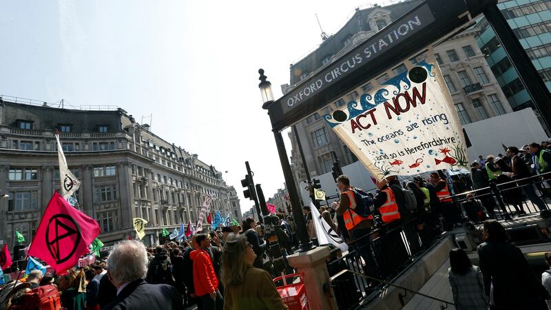 Climate change activists demonstrate at Oxford Circus in London on Monday. Photograph: Peter Nicholls/Reuters