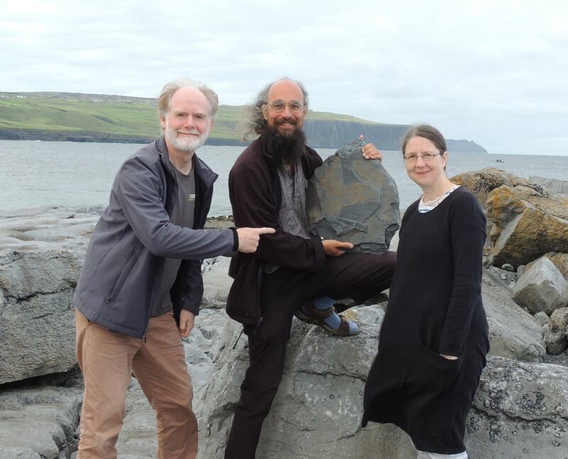 Dr Eamon Doyle (left), Dr Joseph Botting (centre), and Dr Lucy Muir  with fossilised sponge discovered near the Cliffs of Moher in Co Clare. Photograph: Handout/PA Wire 