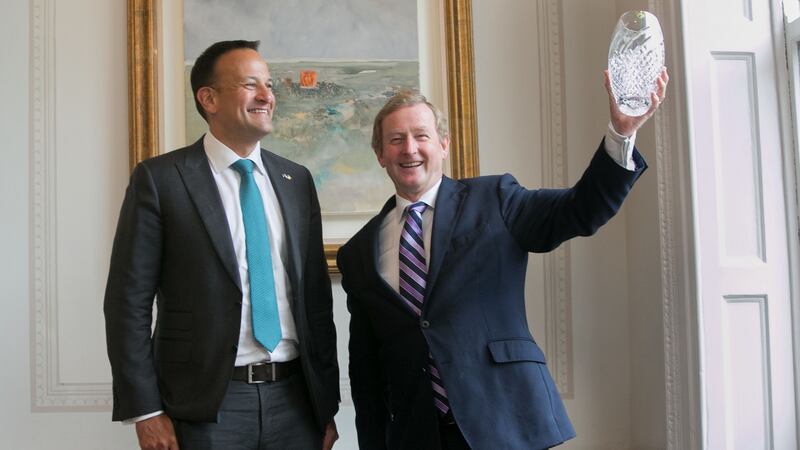 Taoiseach Leo Varadkar TD and  former taoiseach Enda Kenny TD holding his   European of the Year award. Photograph:  Gareth Chaney Collins