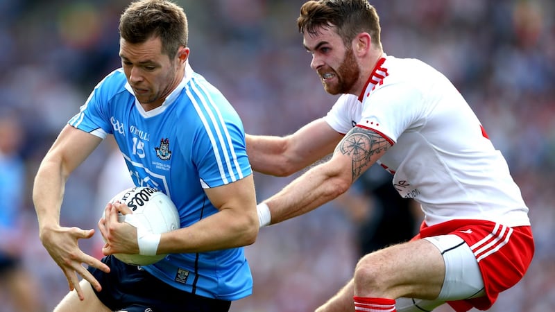 Ronan McNamee tries to tackle Dublin’s Paul Mannion. Photograph: James Crombie/Inpho