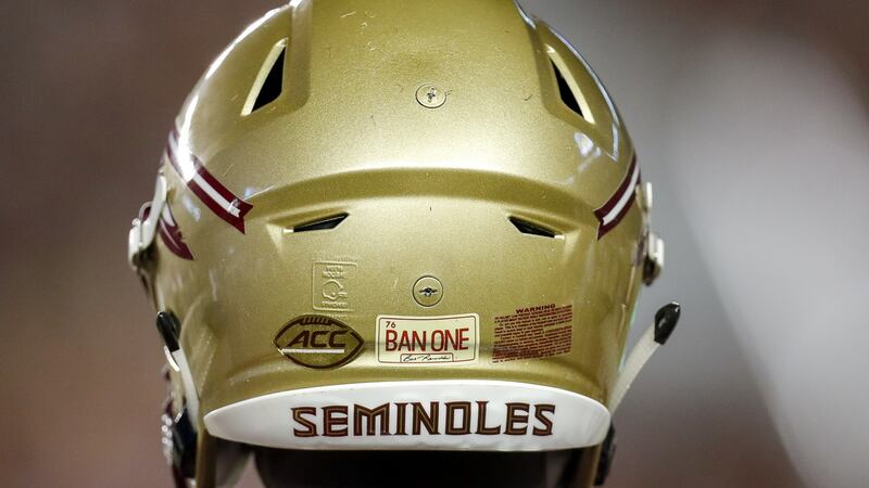 A Florida State Seminoles Helmet with the decal ‘BAN ONE’ honoring alumnus actor Burt Reynolds. Photo: Don Juan Moore/Getty Images