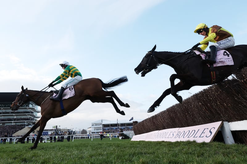 Mark Walsh and Inothewayurthinkin (left) clear the last fence ahead of Paul Townend riding Galopin des Champs. Photograph: Michael Steele/Getty Images