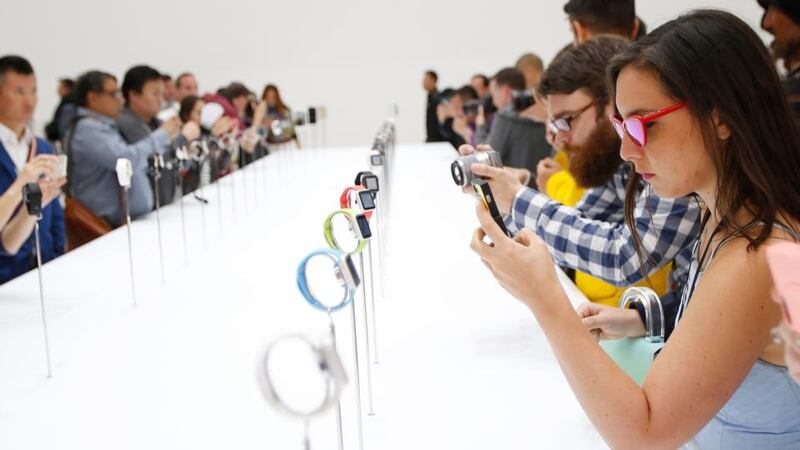 First look: journalists try out the Apple Watch at the launch. Photograph: Monica Davey/EPA