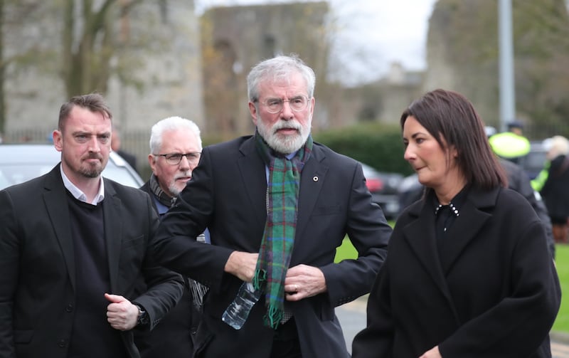 Gerry Adams (centre) arrives at the church in Nenagh, Co TIpperary. Photograph: Collins