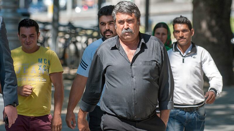 Marioara Rostas’s father Dumitru  with other family members arriving at Central Criminal Court in Dublin in June 2014, where Alan Wilson was on trial for Marioara’s murder. Photograph: Collins Courts