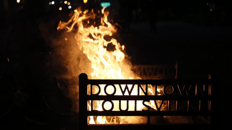 A rubbish bin on fire outside the Louisville Hall of Justice during a protest in Louisville, Kentucky in the  US. Photographer: Luke Sharrett/Bloomberg