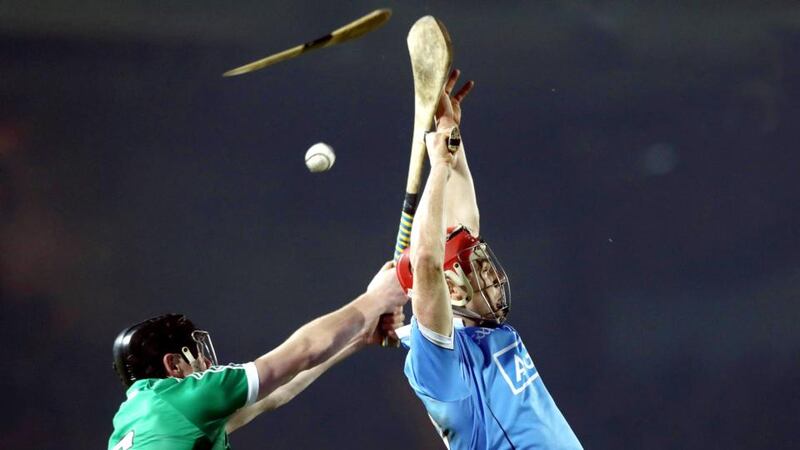 Limerick’s Diarmaid Byrnes and Danny Sutcliffe of Dublin jump for the sliotar during their Division 1B meeting on Saturday. Photo: Lorraine O’Sullivan/Inpho