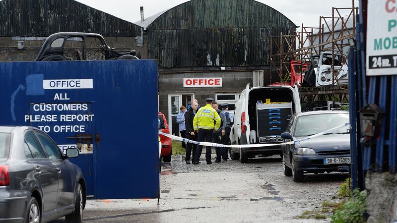 Gardaí  at the scene of a shooting on the Greenhills Road, Walkinstown, Dublin. Photograph: Dara Mac Dónaill/The Irish Times