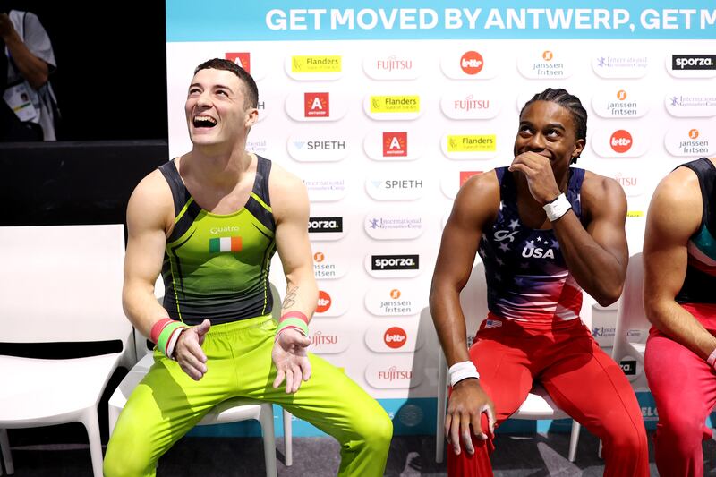 Gold medalist Rhys McClenaghan of Team Ireland and silver medalist Khoi Young of Team United States react after the Men's Pommel Horse Final. Photograph: Naomi Baker/Getty