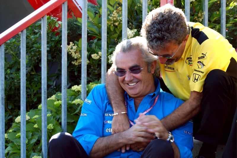 Eddie Jordanh with Benetton-Renault team boss Flavio Briatore in July 2001. Photograph: Neal Simpson/PA Wire