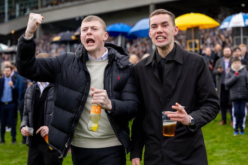 Racegoers cheer on a winner on the first day of the Leopardstown Christmas Festival. Photograph: Morgan Treacy/Inpho