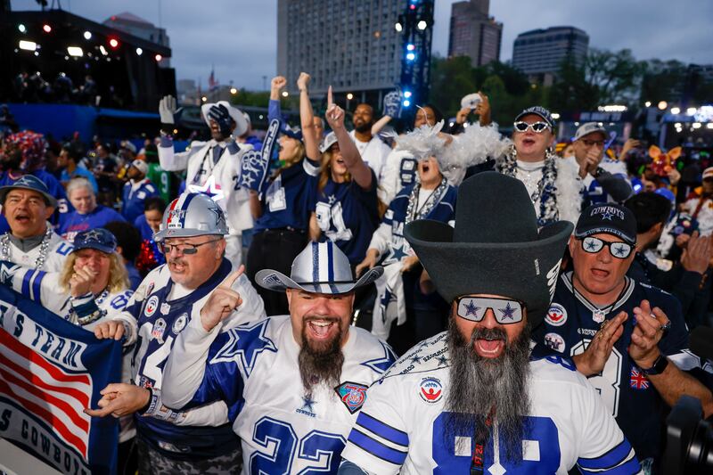 Dallas Cowboys fans react in April to their team's selection in the second round of the 2023 NFL Draft  at Union Station in Kansas City, Missouri. Photograph: by David Eulitt/Getty Images