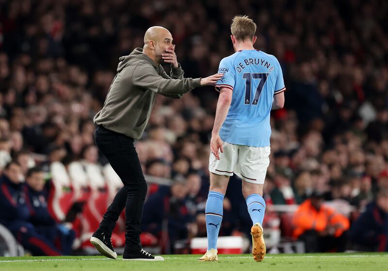 Pep talk: Man City's manager has a discreet word with Kevin De Bruyne during his team's victory at Arsenal. Photograph: Julian Finney/Getty Images