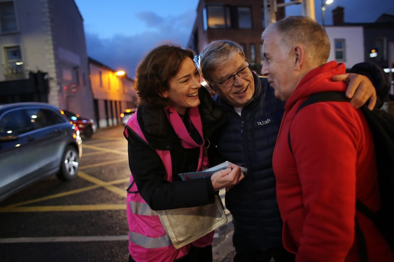 Former Fine Gael TD Kate O’Connell is greeted by well wishing supporters Paschal Naylor, centre, and Irial Slattery while campaigning in Rathgar. Photograph: Bryan O’Brien
