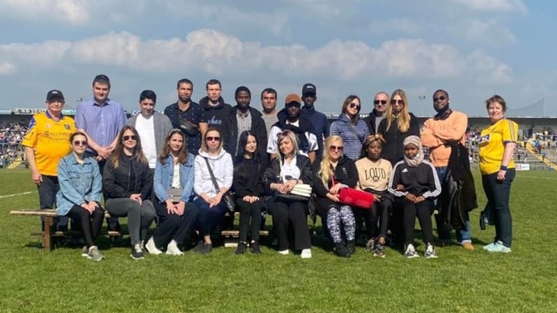 A group of Ukrainian refugees, who are  residing in Roscommon, attending the GAA match between Roscommon and Galway at Dr Hyde Park. Photograph: Roscommon GAA/Facebook