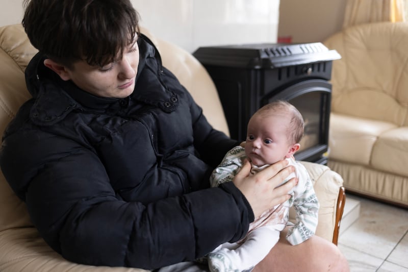 William O’Reilly with his infant son William, from one of the Traveller families at Waterford’s Kilbarry halting site housing scheme. Photograph: Chris Maddaloni/The Irish Times