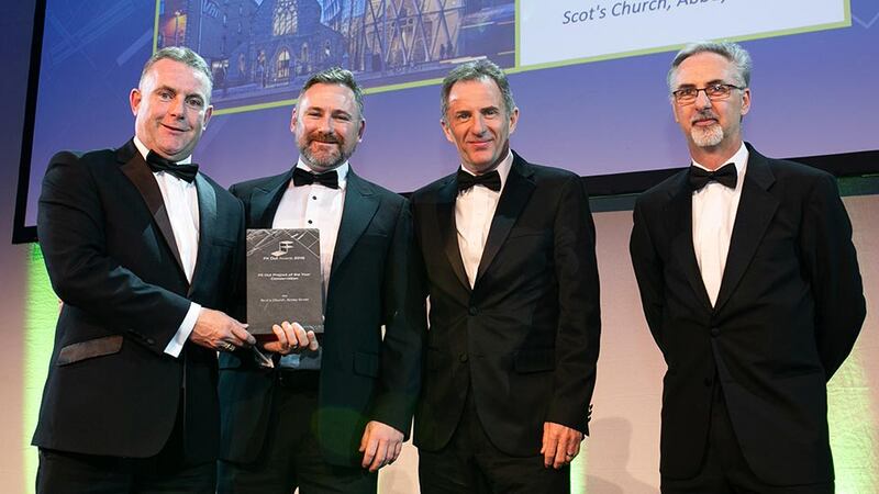 Tom Murnane, Commercial Director, StructureTone presents the Fit Out Project of the Year - Conservation award to Rob Murray, VHI Healthcare, Dan Daye & Kevin Treacy, McCauley Daye O’Connell Architects