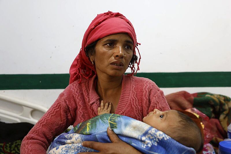 Earthquake victims sit at Bheri Hospital in Nepalgunj, Nepal. Photograph: Narendra Shrestha/EPA-EFE