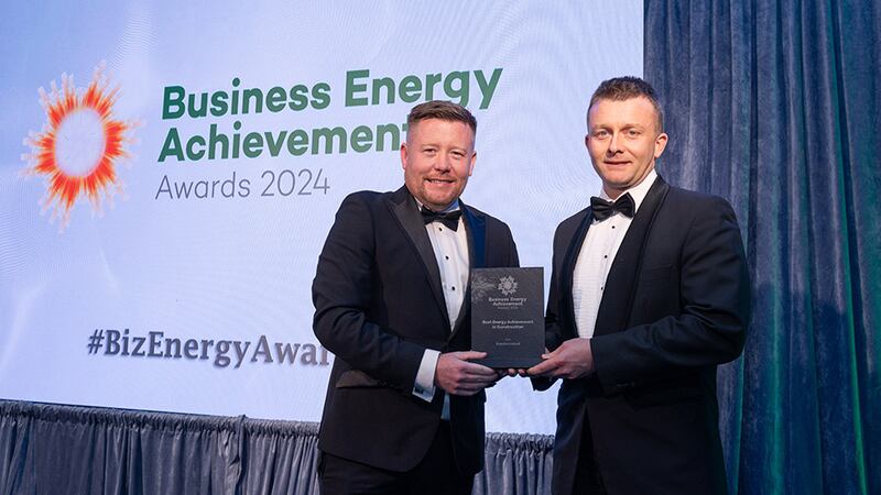 Emmet Lagan, awards judge, presents the best energy achievement in construction award to John Fennell, Breedon Ireland