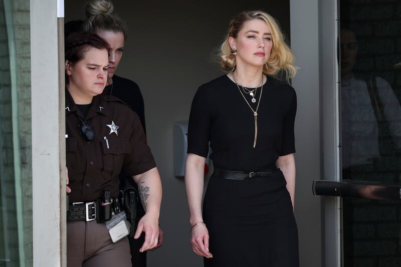 Amber Heard leaves the courthouse in Fairfax, Virginia after the verdict was read out on Wednesday. Photograph: Win McNamee/Getty Images