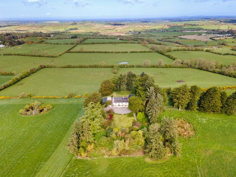 The house is surrounded by almost seven acres