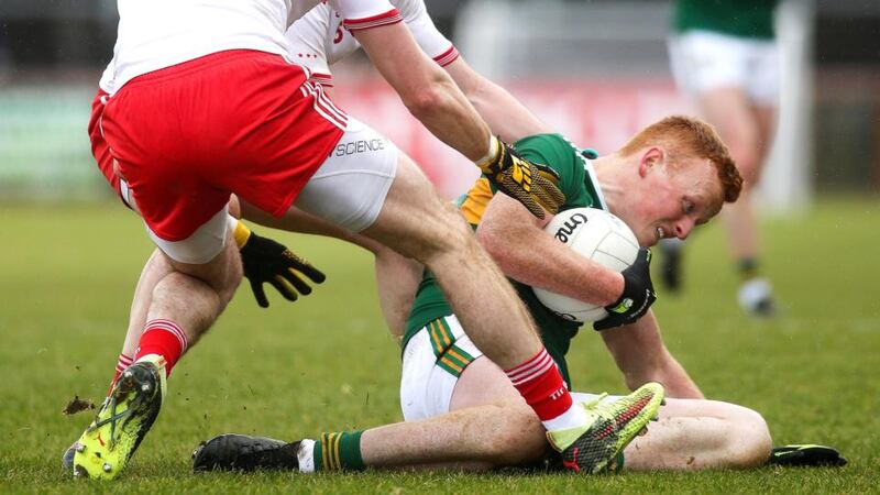 Kerry’s Johnny Buckley is tackled by Tyrone’s Ronan McNamee and Ronan McNabb. Photograph: Lorcan Doherty/Inpho