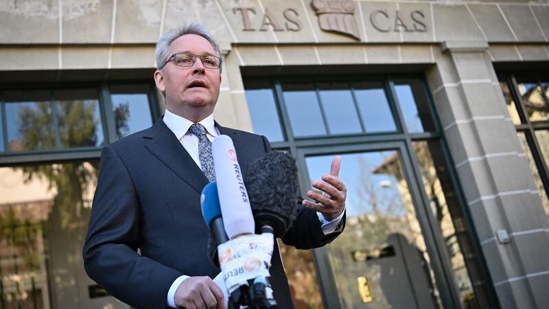 Cas secretary general Matthieu Reeb reads Sun Yang’s sentence in Lausanne. Photograph:  Fabrice Coffrini/AFP via Getty Images