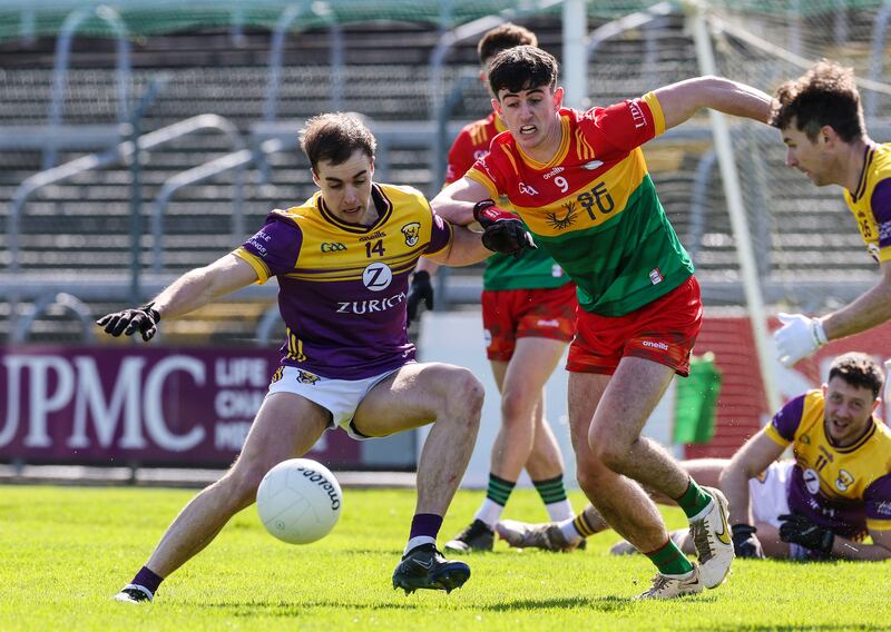 Wexford's Seán Nolan is challenged by Carlow's Niall Hickey. Photograph: Lorraine O’Sullivan/Inpho