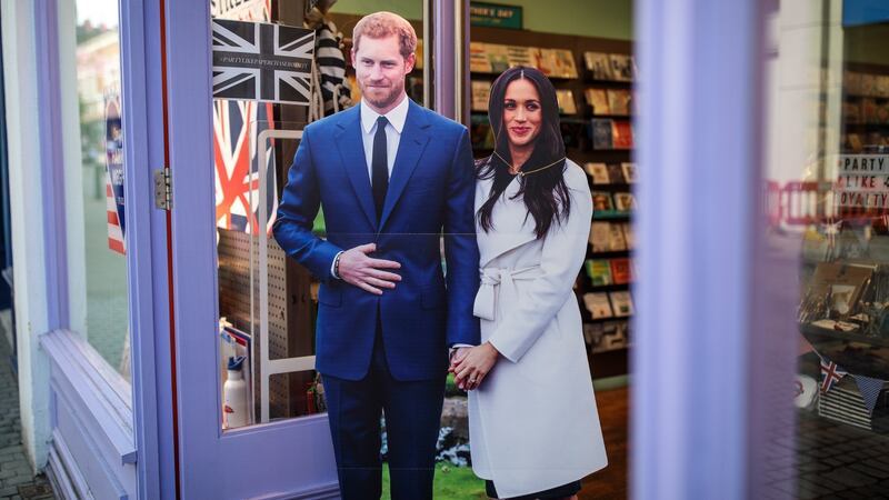 A cardboard cut-out display of Prince Harry and his fiance US actress Meghan Markle sits outside a card shop ahead of the couple’s wedding. Photograph:  Jack Taylor/Getty Images