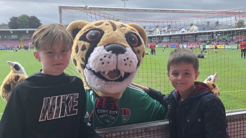 Charlie and Finn Hannigan with the Cork  City mascot at a game in Turner’s Cross in Cork.