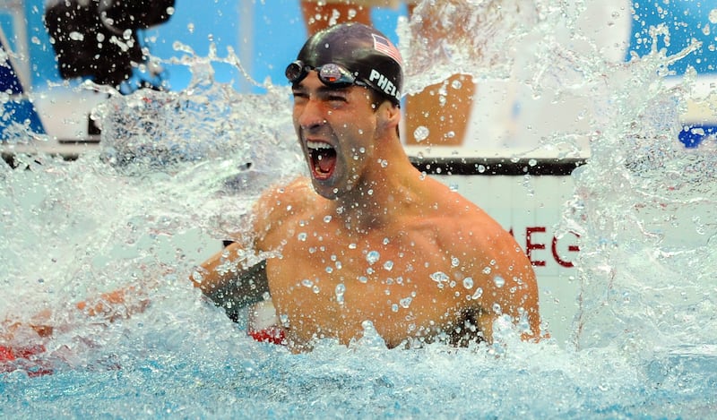 US swimmer Michael Phelps reacts after winning the men's 100m butterfly swimming final at the Beijing Olympic Games in Beijing in 2008. Photograph: Martin Bureau/AFP via Getty Images