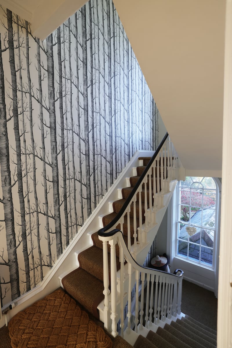 Cole & Son Woods wallpaper, an archive print from 1959, fills the southern boundary wall from the hall all the way up the house. Priced from €138 per roll from Stillorgan Décor (stillorgandecor.ie)