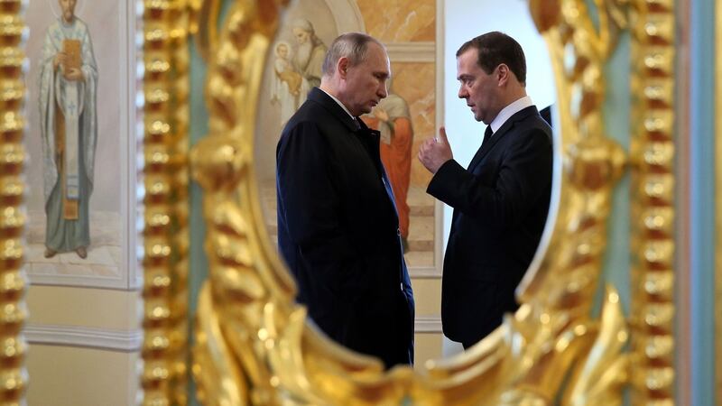 Putin, left, with prime minister Dmitry Medvedev  while visiting the New Jerusalem Resurrection Monastery  , east of Moscow,   in 2017. File photograph: Yekaterina Shtukina/Sputnik/Government Pool Photo via AP