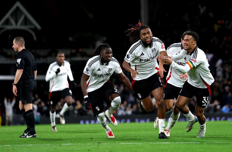 Alex Iwobi celebrates scoring Fulham's third goal with team-mates during the Premier League match against Brighton at Craven Cottage. Photograph: Ryan Pierse/Getty Images