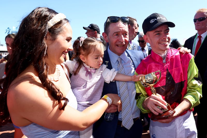 Robbie Dolan celebrates with his family after winning the Lexus Melbourne Cup on Tuesday. Photograph: Josh Chadwick/Getty Images