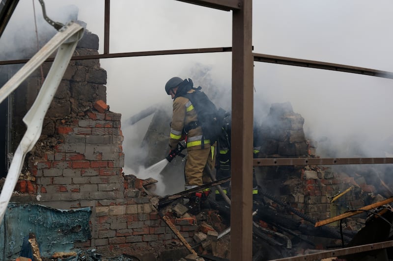 Ukrainian rescuers work at the site of an airstrike on a private building in Kharkiv, northeastern Ukraine, on Christmas Day. Photograph: Sergey Kozlov