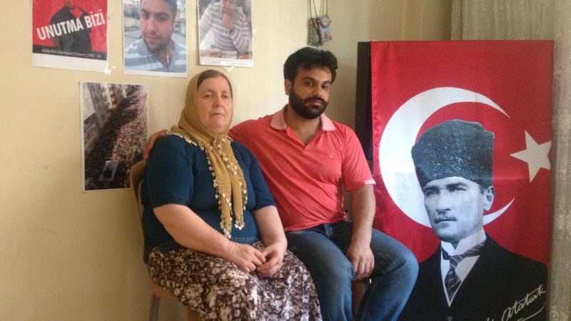 Grieving: Abdullah Comert’s mother and brother. Photograph: Mary Fitzgerald