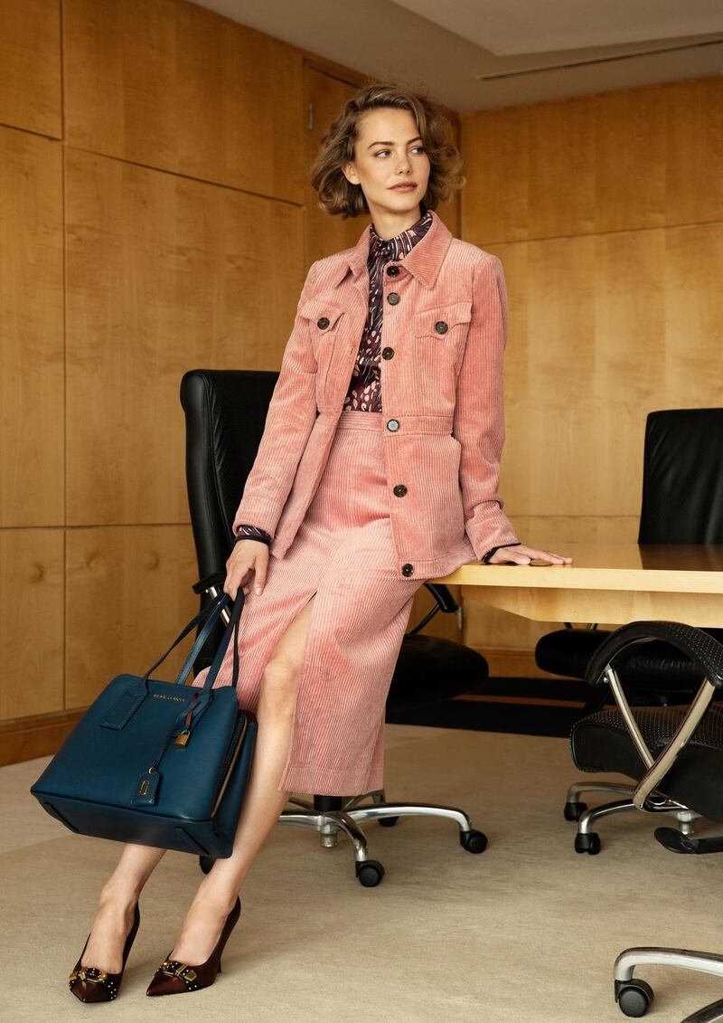 Pink corduroy jacket €630, matching skirt €360 both Alexa Chung, printed blouse €355 Victoria Beckham, navy bag €550 Marc by Marc Jacobs, burgundy shoes €905 Versace. All from Brown Thomas